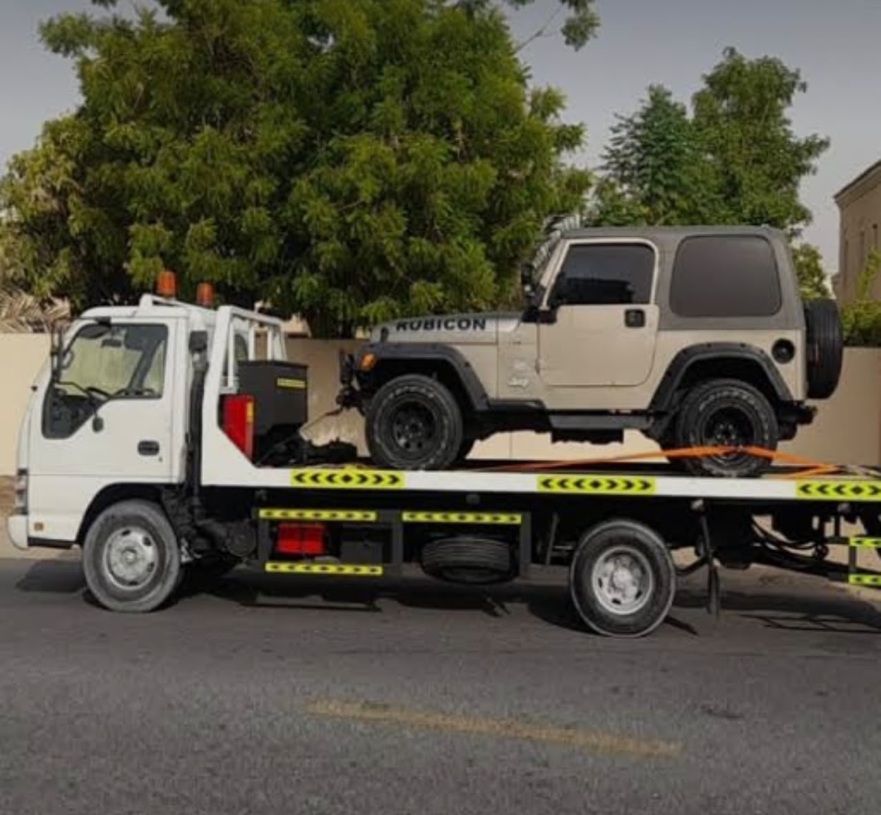Fujairah Recovery Service flatbed towing a Jeep Rubicon