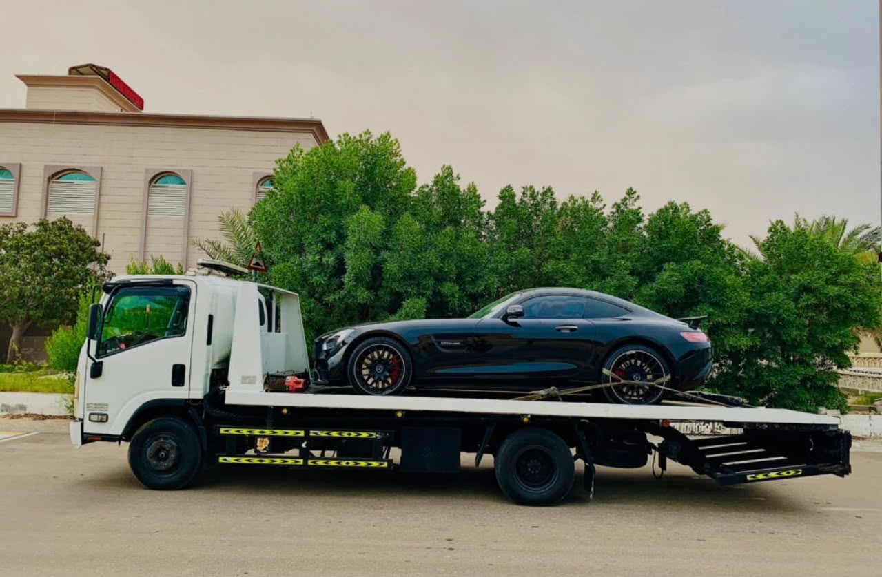 Fujairah Recovery Service flatbed towing a Mercedes AMG GT